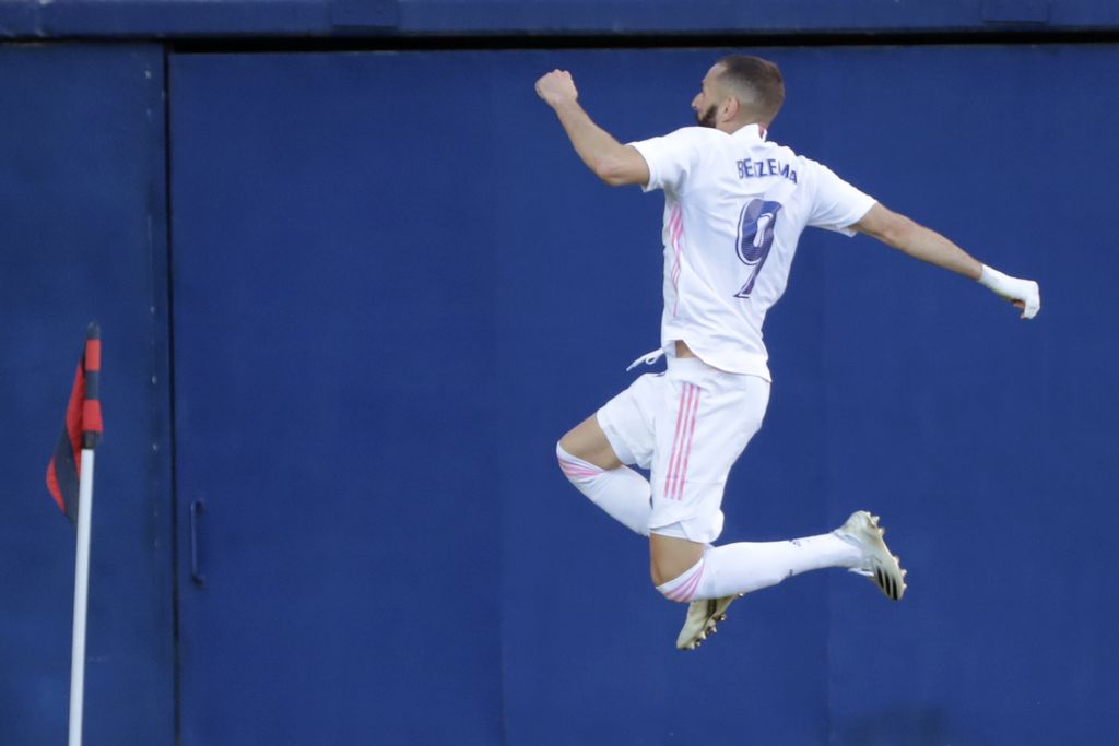 Real Madrid's Karim Benzema, celebrates after scoring the side's second goal during the Spanish La Liga soccer match between Levante and Real Madrid at the Ceramica stadium in Villarreal, Spain, Sunday, Oct. 4, 2020. (AP Photo/Jose Miguel Fernandez)