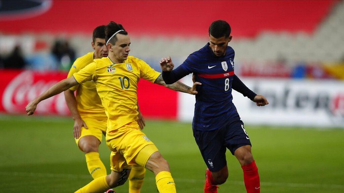 Frances Houssem Aouar, right, challenges for the ball with Ukraines Mykola Shaparenko during their friendly international soccer maths between France and Ukraine at the Stade deFrance in Saint Denis, north of Paris, Wednesday Oct. 7, 2020. (AP Photo/Francois Mori)