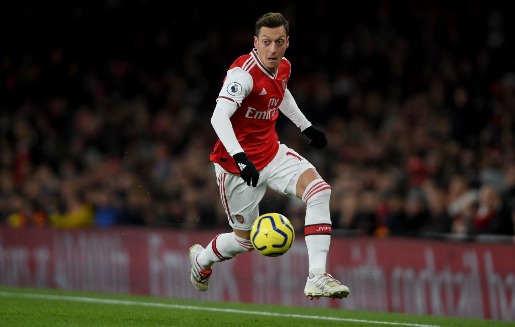 LONDON, ENGLAND - DECEMBER 05: Mesut Ozil of Arsenal runs with the ball during the Premier League match between Arsenal FC and Brighton & Hove Albion at Emirates Stadium on December 05, 2019 in London, United Kingdom. (Photo by Mike Hewitt/Getty Images)