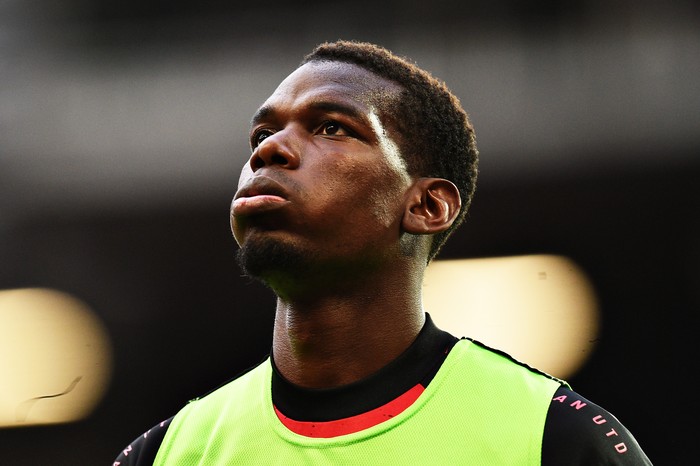 MANCHESTER, ENGLAND - OCTOBER 04: Paul Pogba of Manchester United warms up during the Premier League match between Manchester United and Tottenham Hotspur at Old Trafford on October 04, 2020 in Manchester, England. Sporting stadiums around the UK remain under strict restrictions due to the Coronavirus Pandemic as Government social distancing laws prohibit fans inside venues resulting in games being played behind closed doors. (Photo by Oli Scarff - Pool/Getty Images)