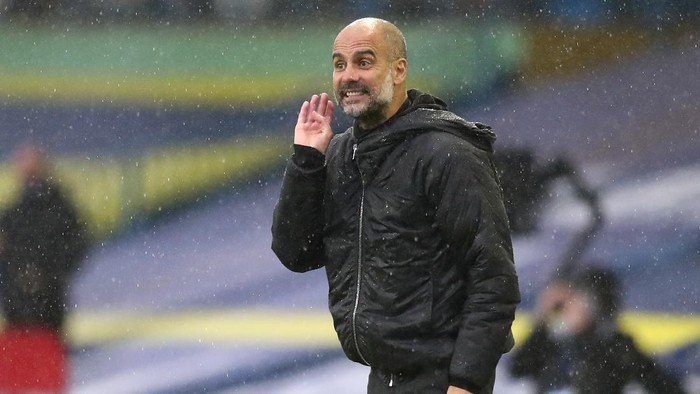 Manchester Citys head coach Pep Guardiola gestures during the English Premier League soccer match between Leeds United and Manchester City at Elland Road in Leeds, England, Saturday, Oct. 3, 2020. (Cath Ivill/Pool via AP)