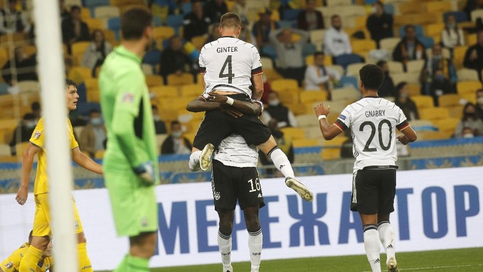 Germanys Matthias Ginter celebrates after scoring his sides opening goal during the UEFA Nations League soccer match between Ukraine and Germany at the Olimpiyskiy Stadium in Kyiv, Ukraine, Saturday, Oct.10, 2020. (AP Photo/Efrem Lukatsky)