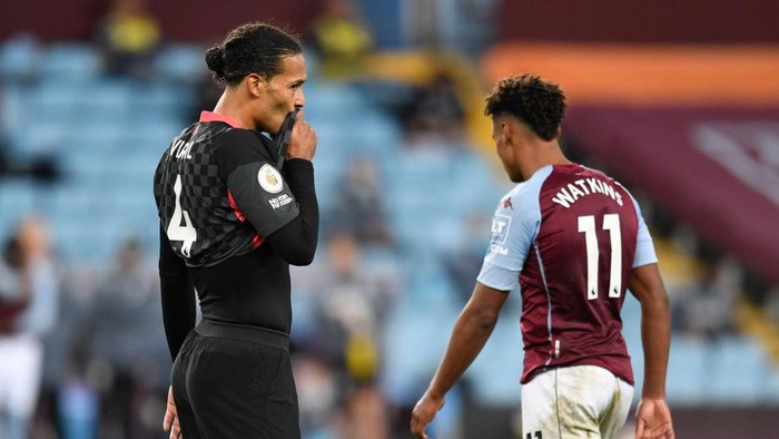 BIRMINGHAM, ENGLAND - OCTOBER 04: Virgil van Dijk of Liverpool reacts as Ollie Watkins of Aston Villa walks past him during the Premier League match between Aston Villa and Liverpool at Villa Park on October 04, 2020 in Birmingham, England. Sporting stadiums around the UK remain under strict restrictions due to the Coronavirus Pandemic as Government social distancing laws prohibit fans inside venues resulting in games being played behind closed doors. (Photo by Peter Powell - Pool/Getty Images)