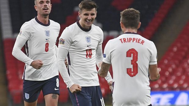 England's Mason Mount, center, celebrates after scoring his side's second goal during the UEFA Nations League soccer match between England and Belgium at Wembley stadium in London, Sunday, Oct. 11, 2020. (Neil Hall/Pool via AP)