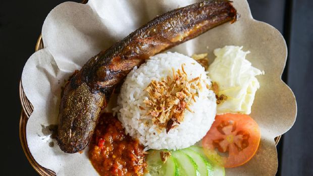 Indonesian Javanese food fish with rice and vegetables