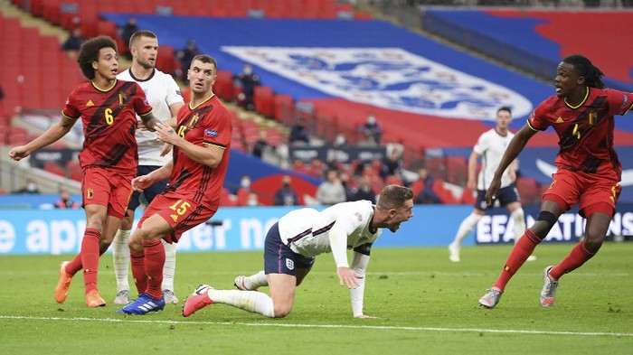 Englands Jordan Henderson, center, reacts as he is bundled over and for which he was awarded a penalty during the UEFA Nations League soccer match between England and Belgium at Wembley stadium in London, Sunday, Oct. 11, 2020. (Michael Regan/Pool via AP)