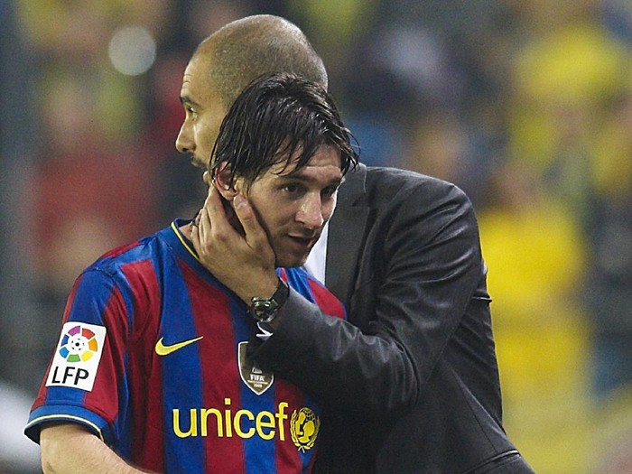 VILLARREAL, SPAIN - MAY 01:  Head coach Josep Guardiola (R) of FC Barcelona embraces Lionel Messi during the La Liga match between Villarreal CF and FC Barcelona at El Madrigal stadium on May 1, 2010 in Villarreal, Spain.  (Photo by Manuel Queimadelos Alonso/Getty Images)