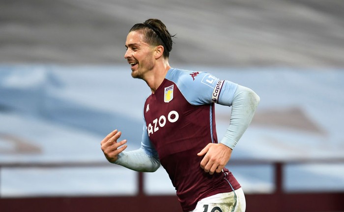 BIRMINGHAM, ENGLAND - OCTOBER 04: Jack Grealish of Aston Villa  celebrates after scoring his teams seventh goal  during the Premier League match between Aston Villa and Liverpool at Villa Park on October 04, 2020 in Birmingham, England. Sporting stadiums around the UK remain under strict restrictions due to the Coronavirus Pandemic as Government social distancing laws prohibit fans inside venues resulting in games being played behind closed doors. (Photo by Peter Powell - Pool/Getty Images)