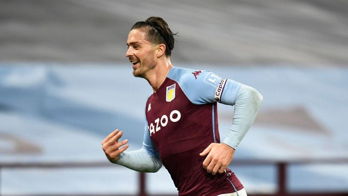 BIRMINGHAM, ENGLAND - OCTOBER 04: Jack Grealish of Aston Villa  celebrates after scoring his teams seventh goal  during the Premier League match between Aston Villa and Liverpool at Villa Park on October 04, 2020 in Birmingham, England. Sporting stadiums around the UK remain under strict restrictions due to the Coronavirus Pandemic as Government social distancing laws prohibit fans inside venues resulting in games being played behind closed doors. (Photo by Peter Powell - Pool/Getty Images)