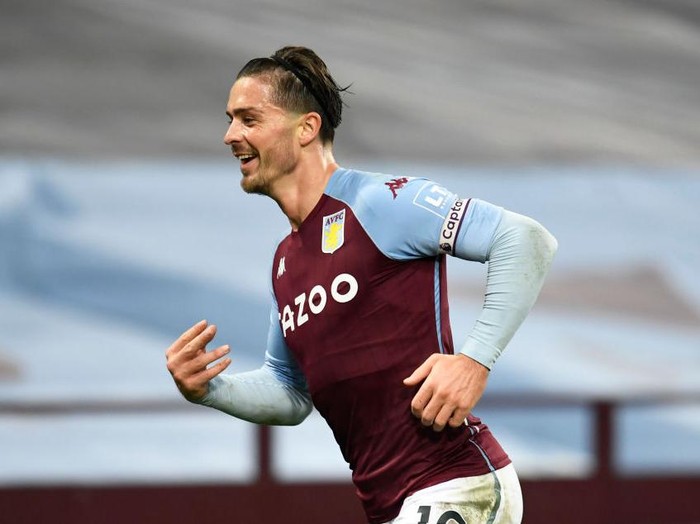 BIRMINGHAM, ENGLAND - OCTOBER 04: Jack Grealish of Aston Villa  celebrates after scoring his team's seventh goal  during the Premier League match between Aston Villa and Liverpool at Villa Park on October 04, 2020 in Birmingham, England. Sporting stadiums around the UK remain under strict restrictions due to the Coronavirus Pandemic as Government social distancing laws prohibit fans inside venues resulting in games being played behind closed doors. (Photo by Peter Powell - Pool/Getty Images)