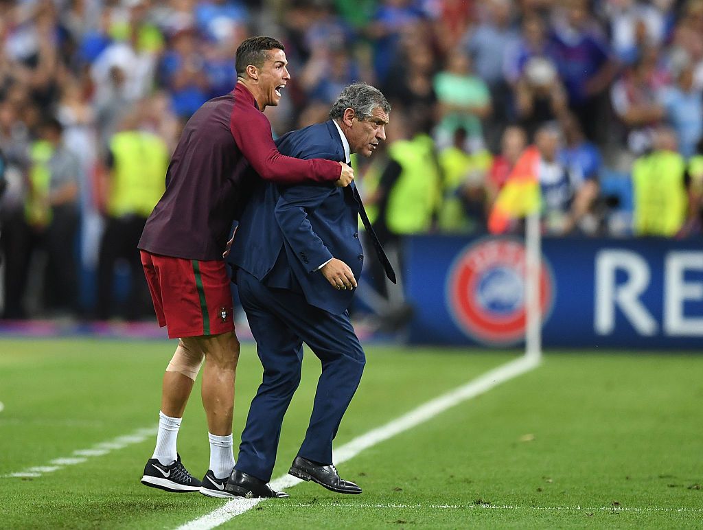 PARIS, FRANCE - JULY 10: Manager Fernando Santos and Cristiano Ronaldo of Portugal celebrate winning at the final whistle during the UEFA EURO 2016 Final match between Portugal and France at Stade de France on July 10, 2016 in Paris, France. (Photo by Laurence Griffiths/Getty Images)