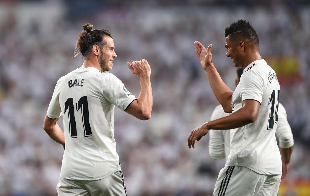MADRID, SPAIN - SEPTEMBER 01:  Gareth Bale of Real Madrid celebrates with Henrique Casemiro after scoring his team's opening goal during the La Liga match between Real Madrid CF and CD Leganes at Estadio Santiago Bernabeu on September 1, 2018 in Madrid, Spain. (Photo by Denis Doyle/Getty Images)