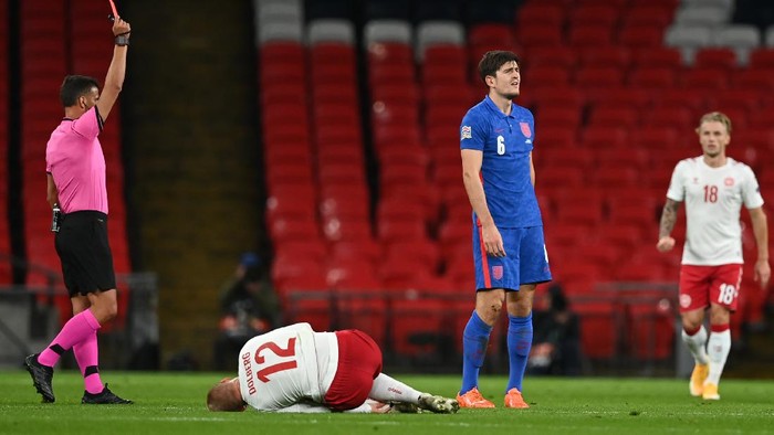 LONDON, ENGLAND - OCTOBER 14: Harry Maguire of England is shown the red card after getting a second yellow card during the UEFA Nations League group stage match between England and Denmark at Wembley Stadium on October 14, 2020 in London, England. Football Stadiums around Europe remain empty due to the Coronavirus Pandemic as Government social distancing laws prohibit fans inside venues resulting in fixtures being played behind closed doors. (Photo by Daniel Leal Olivas - Pool/Getty Images)