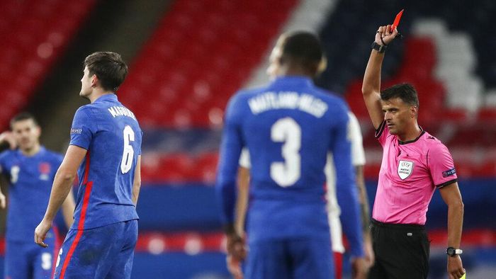 Harry Maguire Referee Jesus Gil Manzano, right, shows a red card to Englands Harry Maguire, left, during the UEFA Nations League soccer match between England and Denmark at Wembley Stadium in London, England, Wednesday, Oct. 14, 2020. (Nick Potts/Pool via AP)