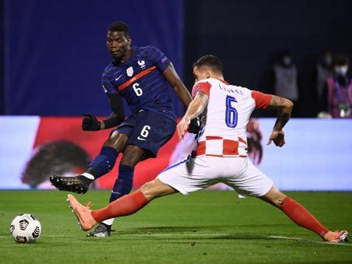 Frances midfielder Paul Pogba (O) vies for the ball with Croatias defender Dejan Lovren  during the UEFA Nations League Group A3 football match between Croatia and France at the Maksimir Stadium in Zagreb on October 14, 2020. (Photo by FRANCK FIFE / AFP)
