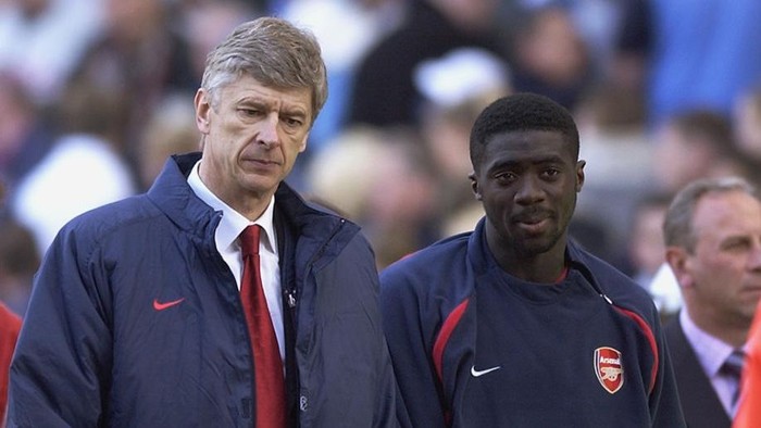 BIRMINGHAM - APRIL 5:  Arsenal manager Arsene Wenger looks dejected as he leaves the field with Kolo Toure of Arsenal during the FA Barclaycard Premiership match between Aston Villa and Arsenal held on April 5, 2003 at Villa Park in Birmingham.  The match was a 1-1 draw.  (Photo By Shaun Botterill/Getty Images)