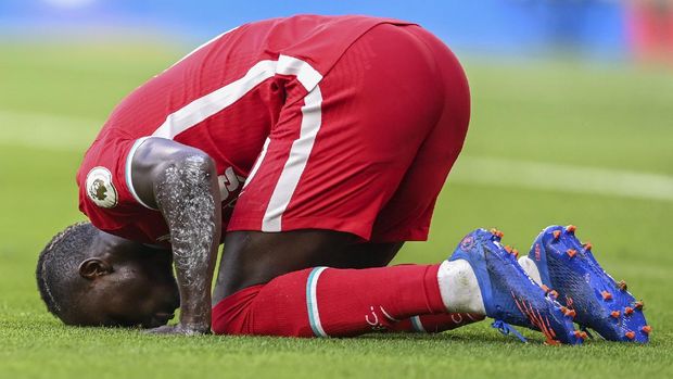 Liverpool's Sadio Mane celebrates after scoring during the English Premier League soccer match between Chelsea and Liverpool at Stamford Bridge Stadium, Sunday, Sept. 20, 2020. (Michael Regan/Pool via AP)