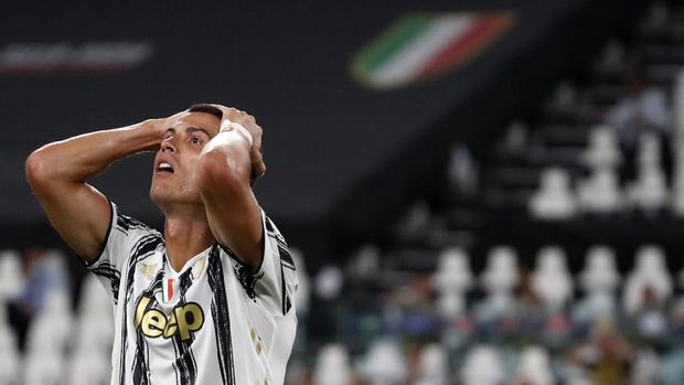 FILE - In this Friday, Aug. 7, 2020 file photo Juventus' Cristiano Ronaldo reacts during the Champions League round of 16 second leg, soccer match between Juventus and Lyon at the Allianz stadium in Turin, Italy. The Portuguese soccer federation says Cristiano Ronaldo has tested positive for the coronavirus. The federation says Ronaldo is doing well and has no symptoms. He has been dropped from the country's Nations League match against Sweden on Wednesday. (AP Photo/Antonio Calanni, File)
