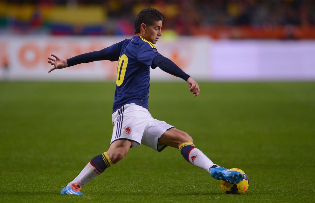 RIO DE JANEIRO, BRAZIL - JUNE 28:  James Rodriguez of Colombia shoots and scoores his team's first goal during the 2014 FIFA World Cup Brazil round of 16 match between Colombia and Uruguay at Maracana on June 28, 2014 in Rio de Janeiro, Brazil.  (Photo by Julian Finney/Getty Images)