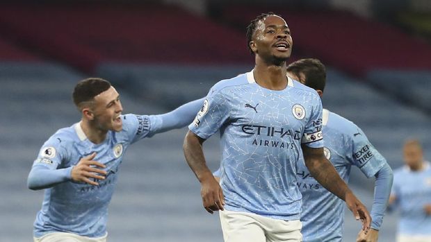 Manchester City's Raheem Sterling, front, celebrates after scoring his side's opening goal during the English Premier League soccer match between Manchester City and Arsenal at the Etihad stadium in Manchester, England, Saturday, Oct. 17, 2020. (Martin Rickett/Pool via AP)