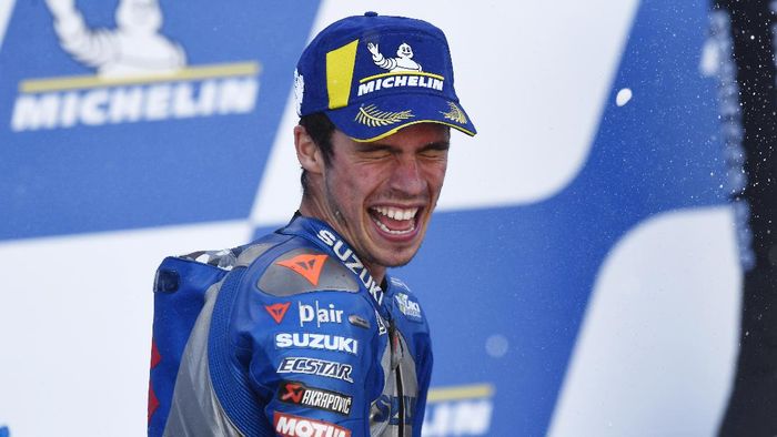 Suzuki rider Joan Mir, of Spain, celebrates on the podium his third place in the Aragon Motorcycle Grand Prix at the Motorland circuit in Alcaniz, Spain, Sunday, Oct. 18, 2020. (AP Photo/Jose Breton)