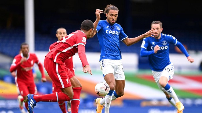 LIVERPOOL, ENGLAND - OCTOBER 17: Dominic Calvert-Lewin of Everton battles for possession with Joel Matip of Liverpool during the Premier League match between Everton and Liverpool at Goodison Park on October 17, 2020 in Liverpool, England. Sporting stadiums around the UK remain under strict restrictions due to the Coronavirus Pandemic as Government social distancing laws prohibit fans inside venues resulting in games being played behind closed doors. (Photo by Laurence Griffiths/Getty Images)