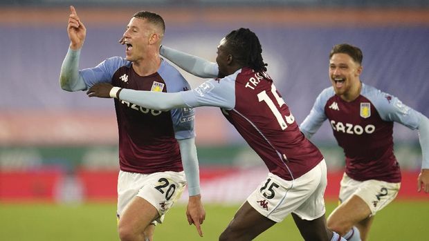 Aston Villa's Ross Barkley, left, celebrates after scoring during the English Premier League soccer match between Leicester City and Aston Villa at the King Power Stadium in Leicester, England, Sunday, Oct. 18, 2020. (Jon Super, Pool via AP)