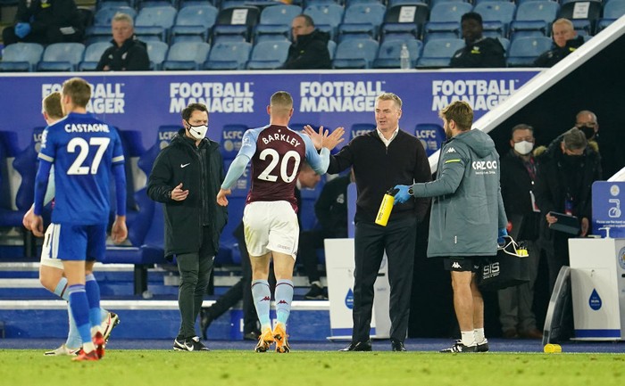 LEICESTER, ENGLAND - OCTOBER 18: Dean Smith, Manager of Aston Villa and Ross Barkley of Aston Villa celebrate following their sides victory in the Premier League match between Leicester City and Aston Villa at The King Power Stadium on October 18, 2020 in Leicester, England. Sporting stadiums around the UK remain under strict restrictions due to the Coronavirus Pandemic as Government social distancing laws prohibit fans inside venues resulting in games being played behind closed doors. (Photo by Jon Super - Pool/Getty Images)