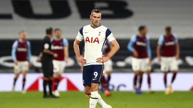 Tottenham's Gareth Bale reacts after West Ham scored their third goal during the English Premier League soccer match between Tottenham Hotspur and West Ham United at the Tottenham Hotspur Stadium in London, England, Sunday, Oct. 18, 2020. (Clive Rose/Pool via AP)
