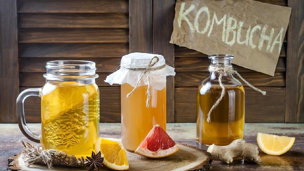 Homemade fermented raw kombucha tea with different flavorings. Healthy natural probiotic flavored drink. Copy space