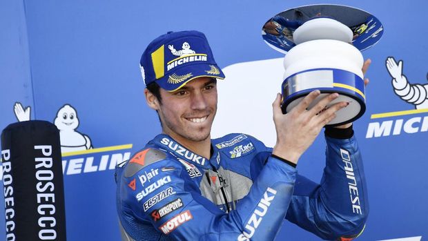 Suzuki rider Joan Mir, of Spain, celebrates on the podium his third place in the Aragon Motorcycle Grand Prix at the Motorland circuit in Alcaniz, Spain, Sunday, Oct. 18, 2020. (AP Photo/Jose Breton)