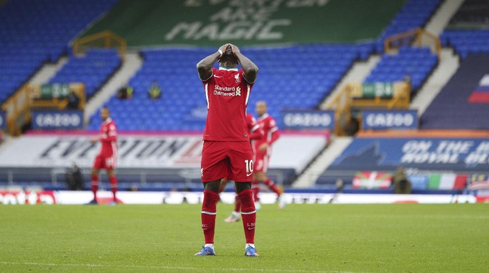 Liverpools Sadio Mane reacts after a bad pass during the English Premier League soccer match between Everton and Liverpool at Goodison Park stadium, in Liverpool, England, Saturday, Oct. 17, 2020. (Peter Byrne/Pool via AP)