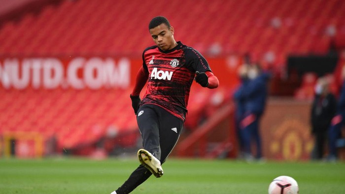 MANCHESTER, ENGLAND - OCTOBER 04: Mason Greenwood of Manchester United warms up ahead of the Premier League match between Manchester United and Tottenham Hotspur at Old Trafford on October 04, 2020 in Manchester, England. Sporting stadiums around the UK remain under strict restrictions due to the Coronavirus Pandemic as Government social distancing laws prohibit fans inside venues resulting in games being played behind closed doors. (Photo by Oli Scarff - Pool/Getty Images)