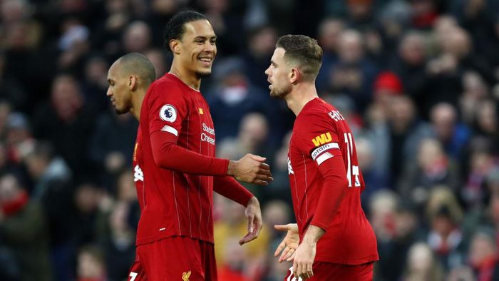 Virgil van Dijk-Jordan Henderson LIVERPOOL, ENGLAND - FEBRUARY 01: Jordan Henderson of Liverpool celebrates with Virgil van Dijk after scoring his teams second goal during the Premier League match between Liverpool FC and Southampton FC at Anfield on February 01, 2020 in Liverpool, United Kingdom. (Photo by Julian Finney/Getty Images)