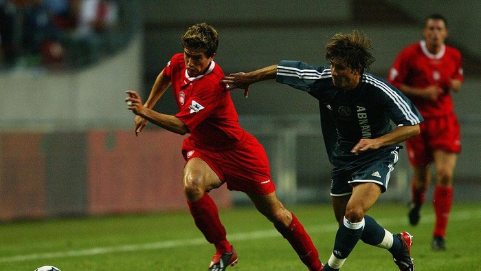 AMSTERDAM - AUGUST 1:  Harry Kewell of Liverpool takes the ball past Maxwell of Ajax during the Sony Amsterdam Tournament match held on August 1, 2003 at The Amsterdam ArenA, in Amsterdam, Holland. The match ended in a 0-0 draw. (Photo by Jamie McDonald/Getty Images)