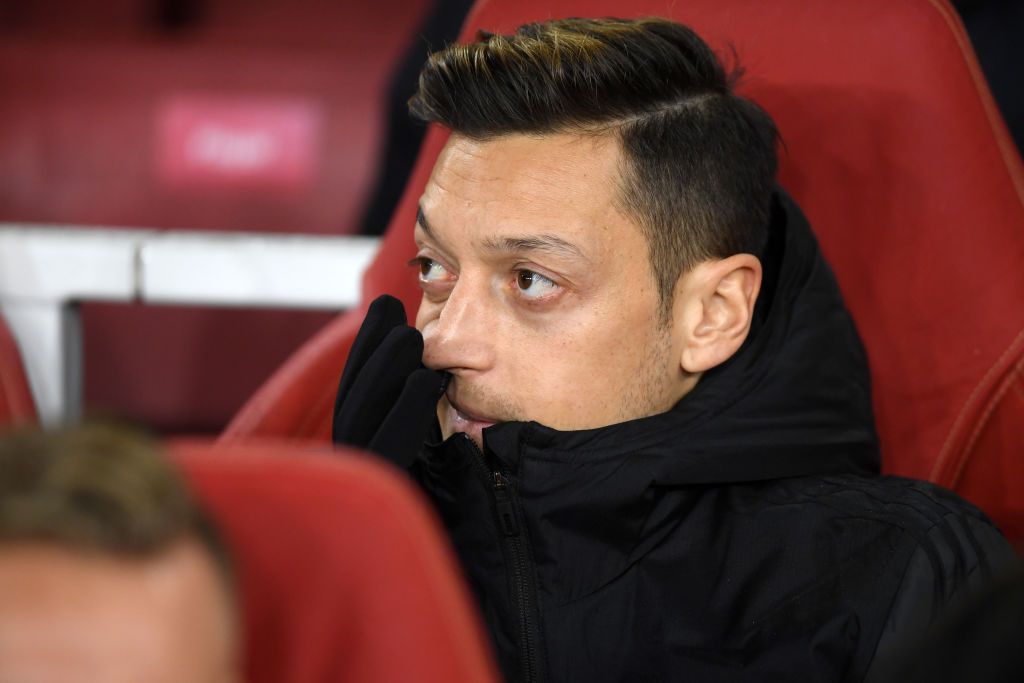 LONDON, ENGLAND - NOVEMBER 28: Mesut Ozil of Arsenal looks on from the substitute bench ahead of the UEFA Europa League group F match between Arsenal FC and Eintracht Frankfurt at Emirates Stadium on November 28, 2019 in London, United Kingdom. (Photo by Mike Hewitt/Getty Images)