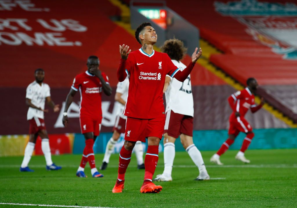 LIVERPOOL, ENGLAND - SEPTEMBER 28: Roberto Firminho of Liverpool reacts during the Premier League match between Liverpool and Arsenal at Anfield on September 28, 2020 in Liverpool, England. Sporting stadiums around the UK remain under strict restrictions due to the Coronavirus Pandemic as Government social distancing laws prohibit fans inside venues resulting in games being played behind closed doors. (Photo by Jason Cairnduff - Pool/Getty Images)