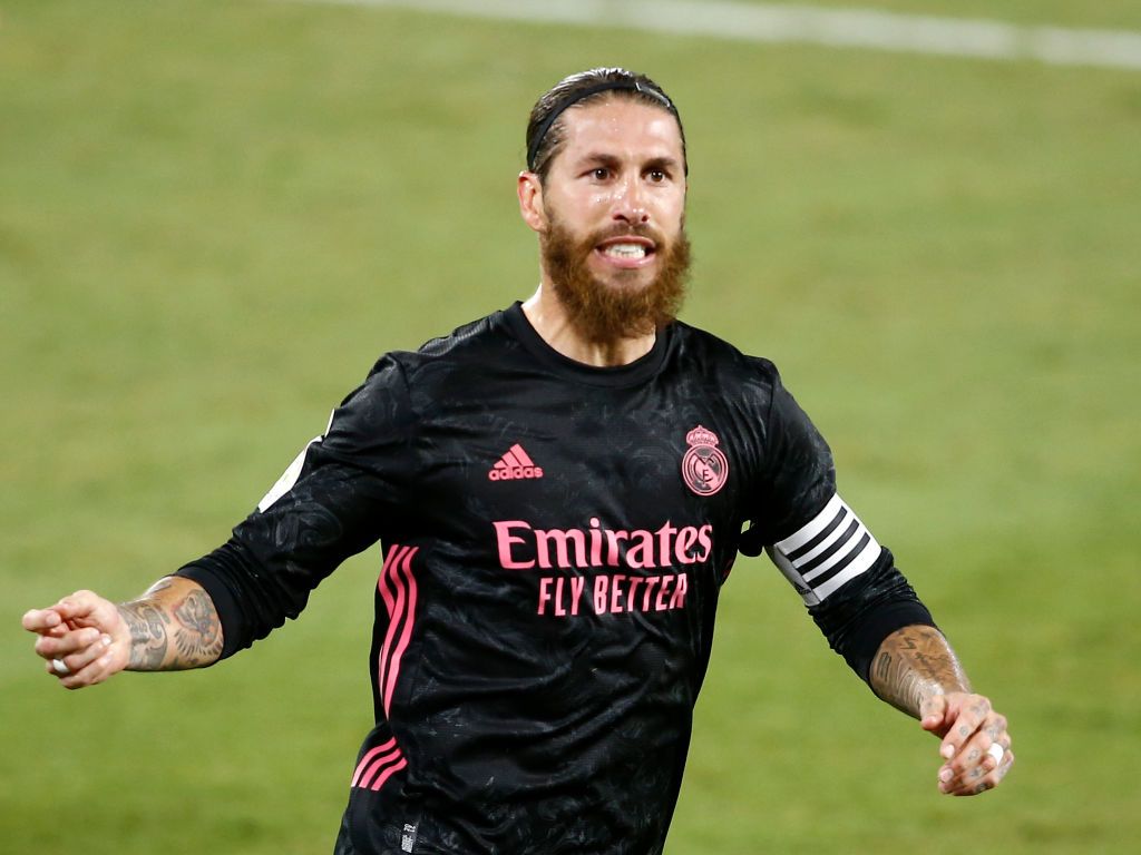 SEVILLE, SPAIN - SEPTEMBER 26: Sergio Ramos of Real Madrid celebrates after scoring his team's third goal from the penalty spot during the La Liga Santander match between Real Betis and Real Madrid at Estadio Benito Villamarin on September 26, 2020 in Seville, Spain. Sporting stadiums in Spain remain under strict restrictions due to the Coronavirus Pandemic as Government social distancing laws prohibit fans inside venues resulting in games being played behind closed doors. (Photo by Fran Santiago/Getty Images)