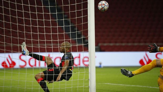Liverpool's Fabinho, saves from the goal line after a header from Ajax's captain Dusan Tadic from scoring during the group D Champions League soccer match between Ajax and Liverpool at the Johan Cruyff ArenA in Amsterdam, Netherlands, Wednesday, Oct. 21, 2020. (AP Photo/Peter Dejong)
