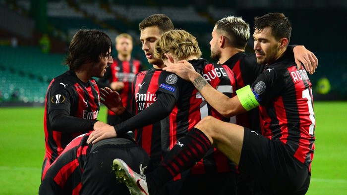 GLASGOW, SCOTLAND - OCTOBER 22: Jens Petter Hauge of AC Milan celebrates after scoring his sides third goal  during the UEFA Europa League Group H stage match between Celtic and AC Milan at Celtic Park on October 22, 2020 in Glasgow, Scotland. Sporting stadiums around the UK remain under strict restrictions due to the Coronavirus Pandemic as Government social distancing laws prohibit fans inside venues resulting in games being played behind closed doors. (Photo by Mark Runnacles/Getty Images)