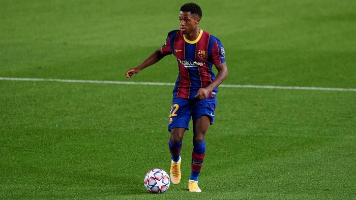 BARCELONA, SPAIN - OCTOBER 20: Ansu Fati of FC Barcelona runs with the ball during the UEFA Champions League Group G stage match between FC Barcelona and Ferencvaros Budapest at Camp Nou on October 20, 2020 in Barcelona, Spain. (Photo by Alex Caparros/Getty Images)