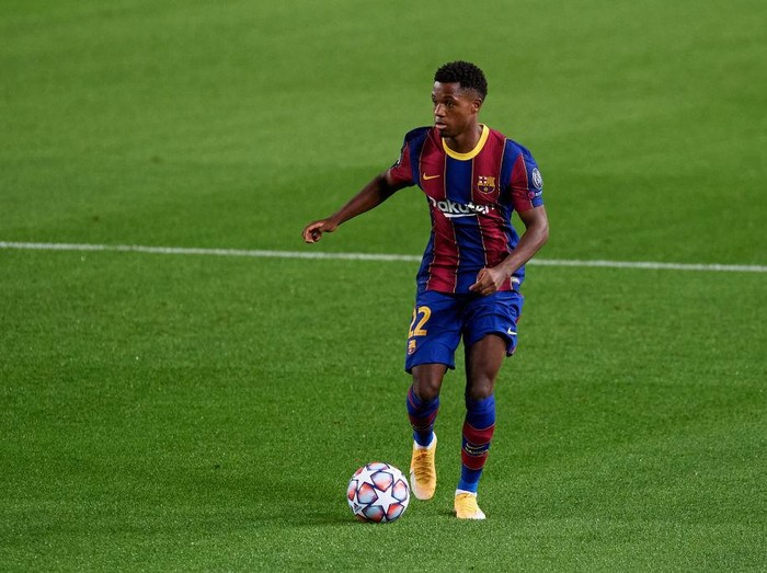 BARCELONA, SPAIN - OCTOBER 20: Ansu Fati of FC Barcelona runs with the ball during the UEFA Champions League Group G stage match between FC Barcelona and Ferencvaros Budapest at Camp Nou on October 20, 2020 in Barcelona, Spain. (Photo by Alex Caparros/Getty Images)