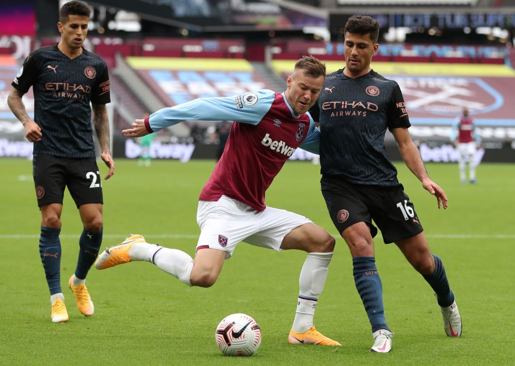 LONDON, ENGLAND - OCTOBER 24: Michail Antonio of West Ham United  scores his team's first goal  during the Premier League match between West Ham United and Manchester City at London Stadium on October 24, 2020 in London, England. Sporting stadiums around the UK remain under strict restrictions due to the Coronavirus Pandemic as Government social distancing laws prohibit fans inside venues resulting in games being played behind closed doors. (Photo by Justin Tallis - Pool/Getty Images)