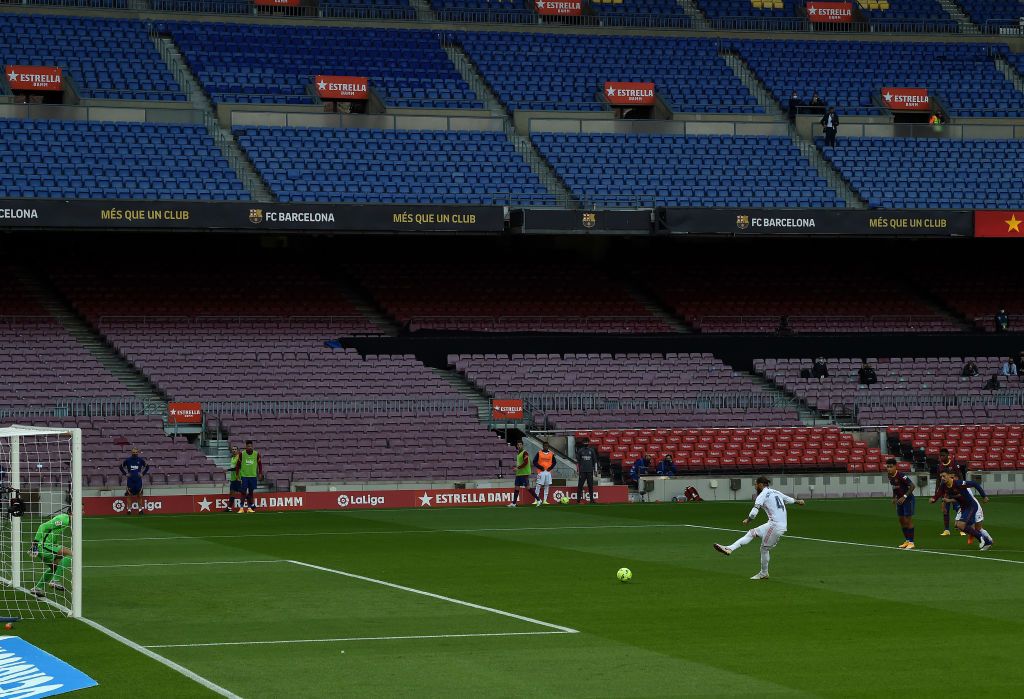 BARCELONA, SPAIN - OCTOBER 24: Sergio Ramos of Real Madrid scores a penalty for his sides second goal from the during the La Liga Santander match between FC Barcelona and Real Madrid at Camp Nou on October 24, 2020 in Barcelona, Spain. Sporting stadiums around Spain remain under strict restrictions due to the Coronavirus Pandemic as Government social distancing laws prohibit fans inside venues resulting in games being played behind closed doors. (Photo by Alex Caparros/Getty Images)