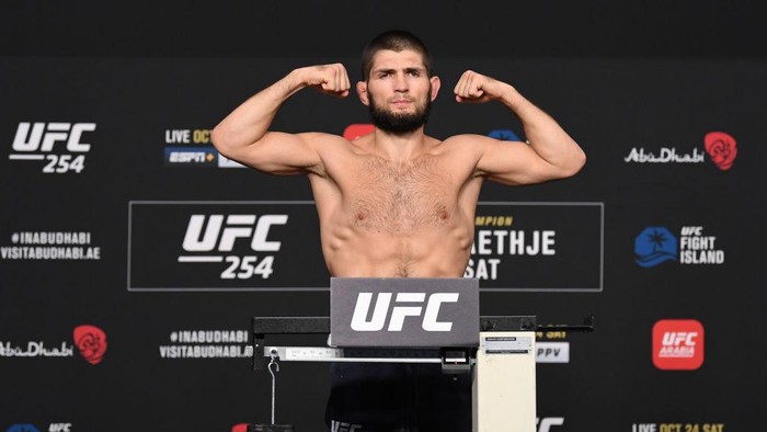 ABU DHABI, UNITED ARAB EMIRATES - OCTOBER 23: In this handout image provided by UFC, Khabib Nurmagomedov of Russia poses on the scale during the UFC 254 weigh-in on October 23, 2020 on UFC Fight Island, Abu Dhabi, United Arab Emirates. (Photo by Josh Hedges/Zuffa LLC via Getty Images)