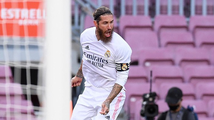 BARCELONA, SPAIN - OCTOBER 24: Sergio Ramos of Real Madrid celebrates after scoring his teams second goal during the La Liga Santander match between FC Barcelona and Real Madrid at Camp Nou on October 24, 2020 in Barcelona, Spain. Sporting stadiums around Spain remain under strict restrictions due to the Coronavirus Pandemic as Government social distancing laws prohibit fans inside venues resulting in games being played behind closed doors. (Photo by Alex Caparros/Getty Images)