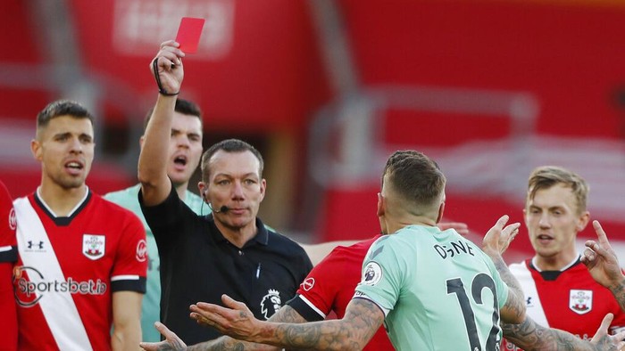 Evertons Lucas Digne, centre right, is shown a red card by the referee after a foul on Southamptons Kyle Walker-Peters during an English Premier League soccer match between Southampton and Everton at the St. Marys stadium in Southampton, England, Sunday Oct. 25, 2020. (AP Photo/Frank Augstein, Pool)