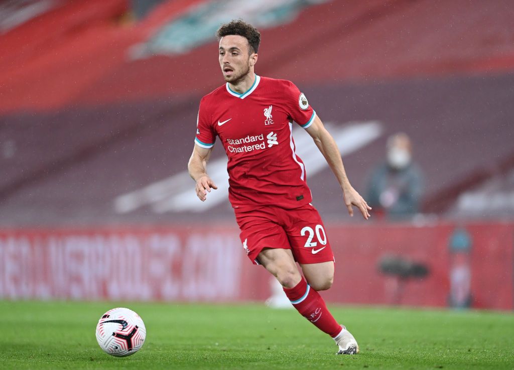LIVERPOOL, ENGLAND - SEPTEMBER 28: Diogo Jota of Liverpool runs with the ball during the Premier League match between Liverpool and Arsenal at Anfield on September 28, 2020 in Liverpool, England. Sporting stadiums around the UK remain under strict restrictions due to the Coronavirus Pandemic as Government social distancing laws prohibit fans inside venues resulting in games being played behind closed doors. (Photo by Laurence Griffiths/Getty Images)