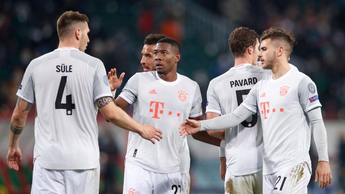 MOSCOW, RUSSIA - OCTOBER 27: David Alaba of Bayern Munich celebrates with Niklas Suele of Bayern Munich and Lucas Hernandez of Bayern Munich after the UEFA Champions League Group A stage match between Lokomotiv Moskva and FC Bayern Muenchen at RZD Arena on October 27, 2020 in Moscow, Russia. A limited number of spectators will be in attendance as Covid-19 pandemic restrictions ease. (Photo by Maxim Shemetov - Pool/Getty Images)