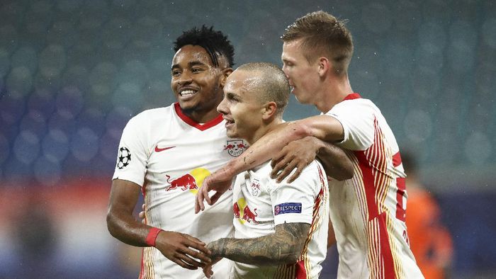 Leipzig LEIPZIG, GERMANY - OCTOBER 20: Angelino of RB Leipzig celebrates with teammates after scoring his teams second goal during the UEFA Champions League Group H stage match between RB Leipzig and İstanbul Basaksehir at Red Bull Arena on October 20, 2020 in Leipzig, Germany. (Photo by Maja Hitij/Getty Images)